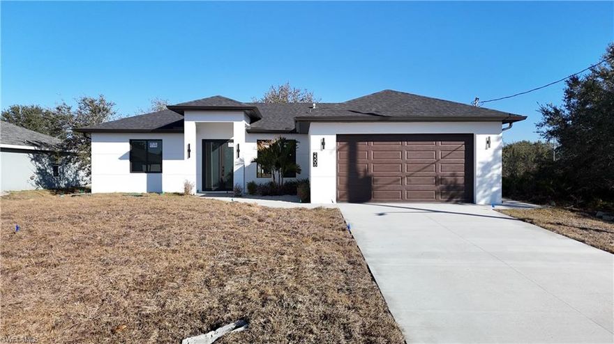 OUTDOOR KITCHEN + COVERED LANIAI | UP TO $10,000 TOWARD BUYER’S CLOSING COSTS | HUGE LEVEL YARD | NO HOA | NO CDD | FLOOD ZONE X | BRAND-NEW CONSTRUCTION

Welcome to this beautifully built home in Lehigh Acres designed for both everyday comfort and outdoor living. The standout feature is the under-truss covered lanai with a full outdoor kitchen and grill finished with granite countertops, perfect for entertaining, family gatherings, or enjoying the Florida lifestyle year-round.
Inside offers 3 bedrooms, 2 bathrooms, a bright open-concept layout, real wood cabinetry, and granite countertops in the kitchen and both bathrooms. The elegant double-door entry adds curb appeal while impact-resistant windows and doors provide safety, durability, and energy efficiency.
All bedrooms include walk-in closets, featuring an extra-large walk-in closet in one guest room and an oversized primary suite closet with exceptional storage space.
The massive, fully leveled backyard provides endless flexibility — ideal for RVs, boats, trailers, work vehicles, or future additions like a pool or workshop.
Conveniently located just minutes from Sunshine Boulevard and Lee Boulevard with restaurants, shopping, and daily conveniences nearby, plus easy access to Fort Myers, beaches, and the airport.
Move-in ready. Built strong. Designed to entertain.