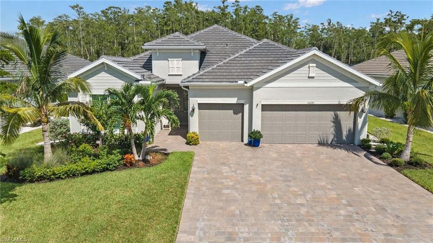 Immaculate!! Contemporary Lennar entertainer, Furniture Negotiable, Professionally decorated, 100k in upgrades in the Executive WildBlue Community, this home offers, a beautiful grand open living room floor plan with plank tiled floors complete home, Impact windows & doors,  deluxe trim package, plantation shutters, tray ceilings, the kitchen in this home is stunning, with a 10 ft. center island, six-person breakfast bar, quartz countertops, stainless steel appliances, double wall oven, walk in pantry, recessed lighting & dining area, living room has a tray ceiling & impact sliding doors that lead you out to your private screened travertine paver saltwater heated pool / spa oasis with a wall mounted fireplace & a custom remote extending awning looking out to the preserve, the master bedroom suite includes lanai access, two walk in closets, the bath includes a huge walk in porcelain tiled frameless glass shower, two separate quartz high-top vanities & a private lavatory, there are two additional ensuites on the other side of the home with a den by the foyer, many upgrades, 700 + acre lake, marina, waterskiing, upscaled amenities, Restaurant, 25 minutes to the Gulf of Mexico beaches.