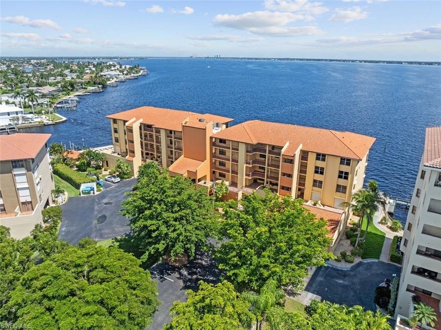 Idyllic unrestricted views of the Caloosahatchee River are breathtakingly beautiful. These views can be seen from your living room, primary bedroom, kitchen and east patio. 
The second bedroom offers picturesque views of the River and marine docks. Off the second bedroom your open private patio offers radiant sunsets that fill the skies with amazing colors. You also have an open west patio off the entry to your residence. 
Take a scenic stroll on the new Captain's walk, observing all the beauty nature has to offer. You may see Dolphins, Manatees, and numerous species of birds during your walk. 
This private end unit is light and bright as pictures show including the "Virtually Staged Furniture" which show future possibilities. 
Tile flooring, new ceiling fans, paint and new carpeting in the living room and primary bedroom. Updated granite kitchen, glass tile black splash, pantry, pass thru to the dining area, split bedrooms. The Primary bedroom opens to the screened lanai, bath features dual vanity, tile shower and walk-in organizer closet. The guest bedroom also has an organizer closet and large window overlooking the boats and river. Utility room: new washer/dryer and water heater and extra cabinetry and storage. 
Updated screened lanai with massive river views has tile floor, new railings and screens. All electric hurricane shutters throughout the unit. Under building, assigned parking just down the stairs with locked storage room.
Relax and Enjoy the Heated Swimming Pool with wide water views, BBQ grill for cookouts with seating and lounge chairs for your suntan, and bathrooms are located at the north end of the building. Just a quick walk to the all new Jaycee Park which should be open soon.
This condominium is available to see anytime. Sorry, no pets allowed. HOA includes building insurance from drywall out and potable water / sewer.