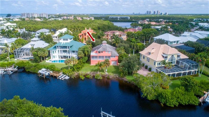 FANTASTIC INVESTMENT OPPORTUNITY in the coveted “Southport on the Bay,” double-gated subdivision of
Collier County/North Naples’ “Barefoot Beach” community! Enjoy the best of both worlds—Beach & Boating, with the beach/Gulf of Mexico a 2-min bike ride away with deeded resident’s access PLUS, for boaters, direct Gulf access in minutes (no bridges) available through Little Hickory Bay & Wiggins Pass*. Offers one of the finest waterfront views with coveted Southern exposure for breathtaking Bayfront sunsets. This concrete block home offers soaring lofted ceilings, a flowing open floor plan, neutral palette, multiple open-air balconies & HUGE
2,500+ sq ft lower-level garage/storage spaces with ability to expand living area if desired. Ideal beach vacation retreat OR an excellent rental income opportunity OR future homesite for your Bayfront dream home. The OPTIONAL in-community “Club at Barefoot” offers boat slips, a pool, tennis, 2 excellent restaurants, beachside food, beverage & beach chair service & planned social activities. Barefoot Beach is perfectly located minutes to Mercato & Waterside Shops with easy access to RSW International Airport & 5th Avenue dining/entertainment.