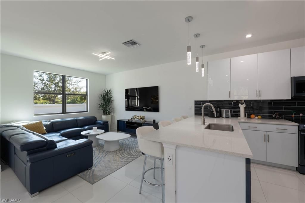 Photo of 7510 Rockefeller DR, NAPLES, FL 34119 (MLS # 226010435)