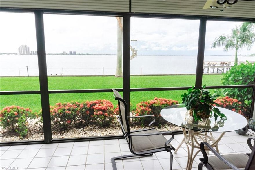 FIRST FLOOR RIVERFRONT - Rarely available, completely updated.  Gorgeous views from every room of the condo and from your private screened lanai!  Extra storage outside the unit and also at your covered - assigned parking area.  Was originally designed as a 2 bed, and the murphy bed is still there for your guests, but current owners preferred the larger living space.  Can easily be made into a permanent 2 bedroom.  Amenities include a dock overlooking the Caloosahatchee river and a gorgeous resort style heated pool, as well as a community room, BBQ area, Billiards, shuffle board and more. Great location just over the bridge in North Fort Myers.  Gated community with 24 hour manned gate.  Make your appt today.