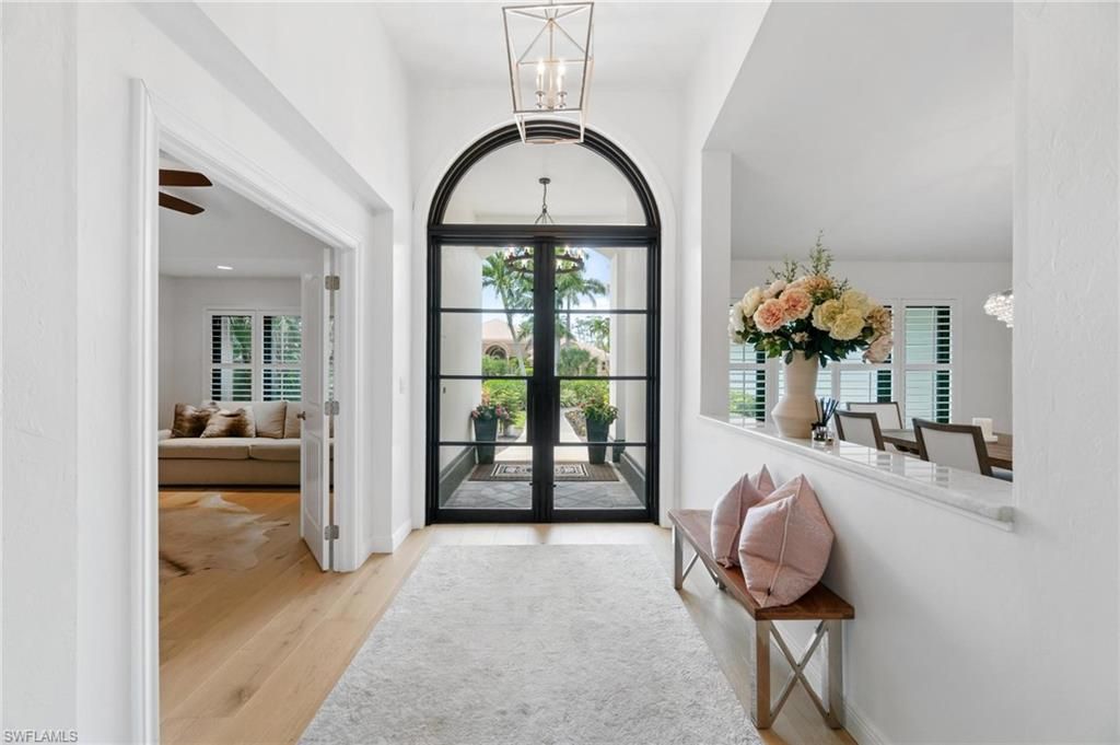 Photo of 12856 Bald Cypress LN, NAPLES, FL 34119 (MLS # 226005339)