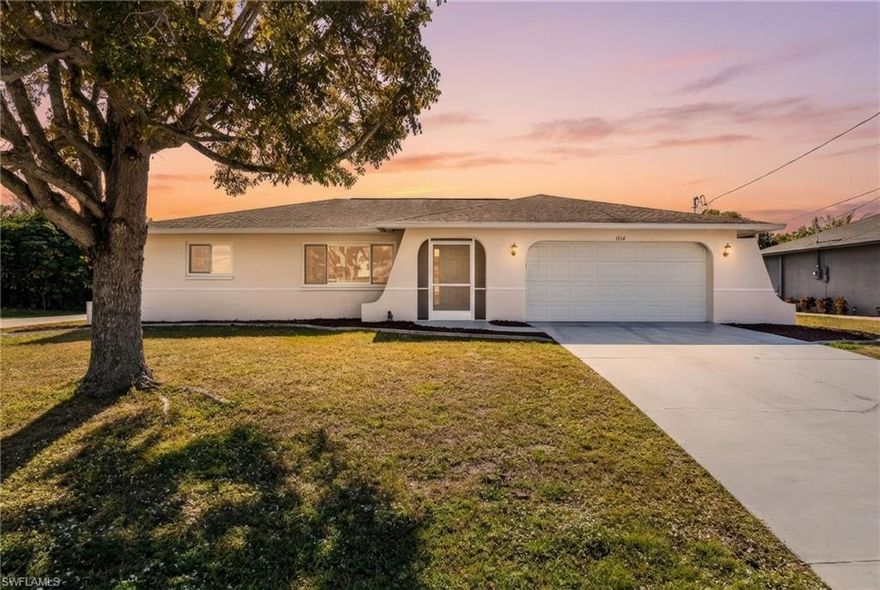 Welcome to this beautifully maintained 3-bedroom, 2-bath pool home located on a desirable corner lot in the heart of SE Cape Coral. Just under 1,500 square feet, this home showcases pride of ownership throughout and has been meticulously cared for by the current owners. The updated kitchen is the heart of the home, featuring granite countertops, woodgrain cabinetry, and a convenient breakfast bar island, perfect for everyday living and entertaining. The open layout flows seamlessly into the living and dining areas, creating a warm and inviting atmosphere. The split floor plan provides ideal separation between the guest bedrooms and the primary suite. The primary suite features a generously spacious sleeping area and a beautifully updated private en suite bathroom. Step outside to your private pool oasis, surrounded by a beautifully landscaped yard accented with decorative lava rock and curbing, offering both curb appeal and low-maintenance living. Additional highlights include a finished garage with a full-wall workbench, ideal for hobbies, storage, or projects, and a thoughtful layout that maximizes space and functionality. Ideally located near the Midpoint Bridge, Del Prado Boulevard, shopping, dining, schools, entertainment, sports complexes, the Caloosahatchee River, and downtown Fort Myers, this home offers convenience without sacrificing comfort. This is a move-in-ready property that truly stands out for its condition, location, and attention to detail. Schedule your private showing today—homes this well cared for don’t last long!