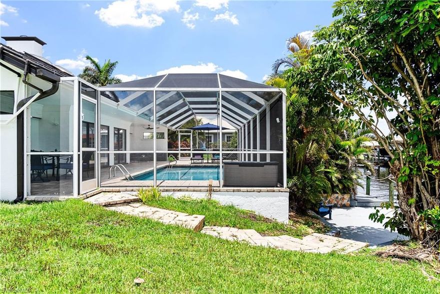 This is a VACATION RENTAL only. Owner will not consider an annual rental. Weekly rentals permitted. Welcome to Villa Linda! Relax and enjoy this spectacular direct sailboat access waterfront home set up to immediately welcome you into Southwest Florida paradise! This fantastic 3-bedroom, 2.5 bath solar heated pool home is on a beautifully maintained property with lush tropical landscaping. It is in a quiet neighborhood conveniently located near various shopping centers, restaurants, and golf courses.

Living Room: The spacious living room is bright and gives a beautiful view of the lanai, pool and canal. Make yourself comfortable and watch a movie on the flat-screen tv while relaxing on the large sectional sofa or light the fireplace for some ambiance.
 
Kitchen/Dining Room: Do you enjoy making yummy treats for you, your family, and your loved ones? The kitchen has granite counters and is fully stocked with all the appliances you might need to produce your own culinary creations. There is a breakfast nook with seating for four located right off the kitchen to enjoy brunch or a quick bite with a lovely view. There is a lovely dining room table set for six. 
 
Master Bedroom/Bathroom: You won't find a retreat more serene than the master bedroom offering a view of the pool. It features a flat-screen tv, a King-sized bed, walk in closet and a seating area. It also features a beautiful en-suite, with his and hers vanities, and  a large walk-in shower. 

Guest Bedrooms/Bathrooms: The first guest room offers a cozy Queen-size bed, flat-screen tv, and private access to the lanai through the large glass sliders. The second guest bedroom offers a Queen-size bed and flat-screen tv. The guest bedrooms share the second bathroom with a spacious shower/tub combo and doubles as the pool bath with direct access to the large pool. 
 
Pool/Lanai: Enjoy your company on the lanai, which offers multiple seating areas for gatherings where you can relish relaxed conversation and a cocktail. Better yet, have dinner poolside with the provided propane gas grill and dining area that seats up to six people. Go for a swim in the beautiful solar heated pool or enjoy sunbathing in the beautiful Florida heat on the lounge chairs available. You can relax under the stars or drop a line in the water and catch dinner! Feeling adventurous? Enjoy the neighborhood with the bikes provided for your use.
 
There is plenty of entertainment available for Everyone!

Experience an easy, comfortable, and relaxing getaway to the Sunshine State at Villa Linda. Book Today!