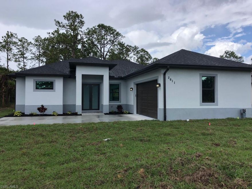 NEW CONSTRUCTION ....BEAUTIFUL 3 BEDROOMS , 2 BATH AND 2 CAR GARAGE SITS ON A 1.59 ACRES LOT , THIS IS WILL A BRAND NEW HOME THAT HAS A BRIGHT AND FORMAL LIVING ROOM AND DINING ROOM, SPECIAL FEATURES INCLUDES: IMPACT WINDOWS AND DOORS, QUARTZ COUNTER TOPS, APPLIANCES THAT ARE STAINLESS STEEL, ASPHALT PAVED DRIVEWAY, 24X24 PORCELAIN TILE, BASEBOARDS, AND MANY MORE UPGRADENS!! ...