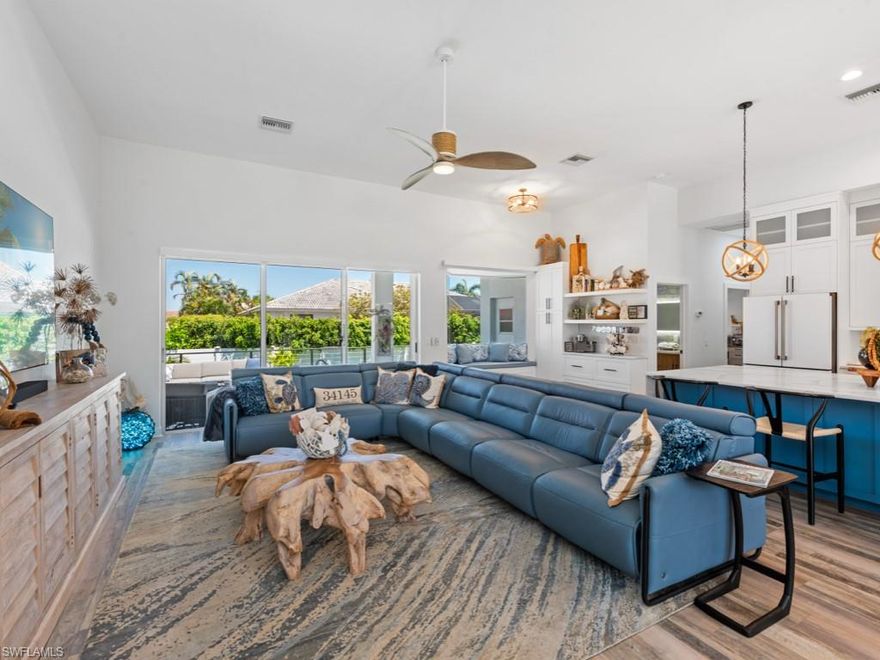 Exceptional, newly remodeled home located in the highly desirable South End of Marco Island exudes a sophisticated, tropical, resort-like style. This phenomenal 3 bedroom, 3 bath home was meticulously remodeled in 2024 and features thoughtful custom details, coastal accents, and luxurious appointments throughout. Upon entering, you will be greeted by the spacious open floor plan with 12’ ceilings bathed in natural light created by seamlessly blending the sitting room, living room, and kitchen together. The kitchen is any chef’s dream complete with stunning waterfall center island, beautiful custom white cabinetry, high-end designer appliances, custom coffee bar, and custom window seat overlooking the pool and backyard. The master suite is a true oasis featuring access to the lanai, walk-in closet, and spa-like en-suite bath. The master bath boasts dual sinks, custom cabinetry, lighted vanity mirror, and an exquisite, island-inspired walk-in shower. Your guests will enjoy the privacy provided by the two additional spacious guest bedrooms both with en-suite baths. The coastal interior opens to the lanai with ample seating space, pool, and much privacy. Enjoy both covered and open areas, creating the perfect place to lounge poolside basking in the Florida sunshine or dine alfresco after a day spent at the beach. This tropical retreat is ideally located only a short stroll, less than half a mile, away from Marco’s world-famous white sand beach and sparkling blue waters of the Gulf. Many dining, shopping, and entertainment options are also conveniently located nearby. With its island chic interior and prime location, this magnificent island home checks all the boxes.