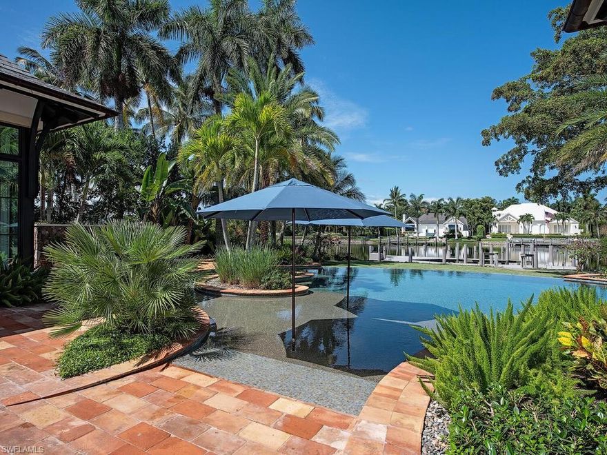 Beautiful custom Port Royal estate home.  Built by BCB homes and designed by Stofft Cooney architects. Wonderful courtyard entry with water feature.  Great home for entertaining , large resort like pool with separate spa.  The unique outdoor tile is from Provence France, and is  reclaimed farmhouse tiles,absoultely stunning.  There is a large lanai area with outdoor kitchen, bar and dining area. First floor guest suite with living room.  6 bedrooms all ensuite.  3 car garage .