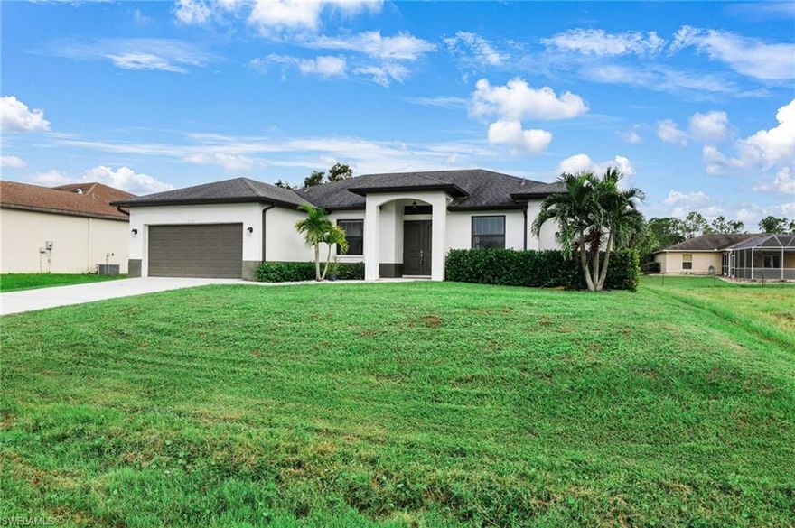 LIKE NEW but even BETTER!! This 3-Bedroom+den, 2-bath, 2-car garage MOVE-IN READY home is located in the highly desirable neighborhood of Buckingham Park with NO HOA and NO FLOOD ZONE. The double door entry invites you into a well-designed floor plan of 1847 sf with split bedrooms and NEW TILE throughout – NO CARPET ANYWHERE. There are 12-foot. ceilings and 8-foot doors throughout the home. The expansive great room with coffered ceiling opens onto the over-sized screened lanai to provide the perfect flow for entertaining guests and holding family events. With a ¼ acre lot, there is plenty of room for a pool. For safety and security, all windows and sliding doors are HURRICANE IMPACT RESISTANT. The EAT-IN KITCHEN offers timeless 42” white wooden kitchen cabinets, stylish white QUARTZ countertops, a large peninsula with wrap-around breakfast bar, and stainless steel appliances. There is abundant natural light with a triple slider leading to the screened patio. The stone accent wall with fireplace in the living room and the framed wall in the dining room add special touches to the feeling of home. The primary bedroom suite includes a large bedroom, TWO WALK-IN CLOSETS, and private bath with dual sinks and a HUGE walk-in shower. The split bedroom floor plan offers two additional bedrooms and a full bath for your family and guests. The brightly lit den opens off the living room for your home office or whatever additional space your family needs. The long driveway and 2-car AIR CONDITIONED GARAGE give you ample room for your vehicles, toys, storage, and workout space. Buckingham Park is a growing community that offers that country feel while being within easy commuting distance of all that the Fort Myers area has to offer for work, shopping, sports, travel, and entertainment. Schedule your showing today! This is the one that is going to “feel like home!”