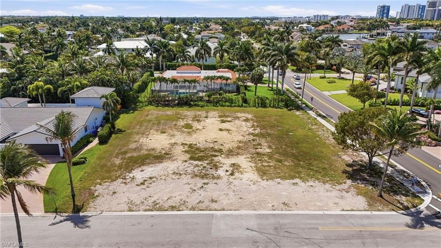Build your dream home in the highly sought-after Park Shore neighborhood of Naples on this oversized corner lot with coveted southern rear exposure, ensuring abundant natural light and optimal sun on your future outdoor living spaces. The generous parcel can accommodate a residence of up to 7,000 square feet under air while still preserving ample yard space—offering exceptional flexibility to design a home tailored to your lifestyle. Preliminary architectural plans are available to help jumpstart your vision. Ideally located just moments from the private Park Shore Association beach access, as well as premier shopping and dining at Waterside Shops and Venetian Village, this property also enjoys convenient proximity to a brand-new Publix currently underway. A rare opportunity to secure a prime homesite in one of Naples’ most prestigious coastal communities.