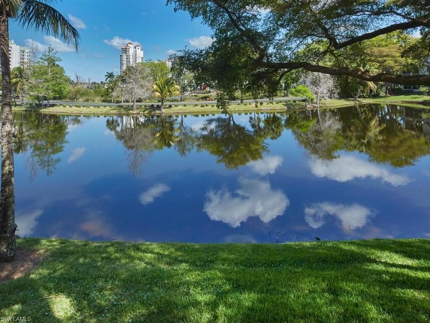 Enjoy breathtaking panoramic lake views from this beautifully maintained three-bedroom, two-bath second-floor residence in Bay Pointe. This light-filled condominium features PGT impact-rated, UV-resistant sliders that enclose the lanai—creating a seamless indoor-outdoor living space—along with no-see-um screens and elegant plantation shutters throughout. The updated kitchen showcases stunning Pompeii quartz countertops, a stylish tile backsplash, and newer appliances, including a Whirlpool stainless steel 46-bottle dual-zone wine cooler—perfect for entertaining. Stay organized with built-in cabinetry and shelving in the great room and third bedroom, plus numerous closets for storage. Recent upgrades add both style and peace of mind, including LED lighting, updated bathroom fixtures, modern door hardware, a glass shower enclosure, garage door opener, and newer laundry appliances. Experience the exceptional lifestyle of Bonita Bay, offering a private beach park on the Gulf of Mexico, three scenic parks, miles of walking and biking trails, pickleball, playgrounds, a full-service marina, waterfront dining, and more. Optional membership to the prestigious Bonita Bay Club provides access to world-class amenities, including five championship golf courses, tennis and pickleball facilities, a state-of-the-art fitness center, spa services, and an array of dining venues.