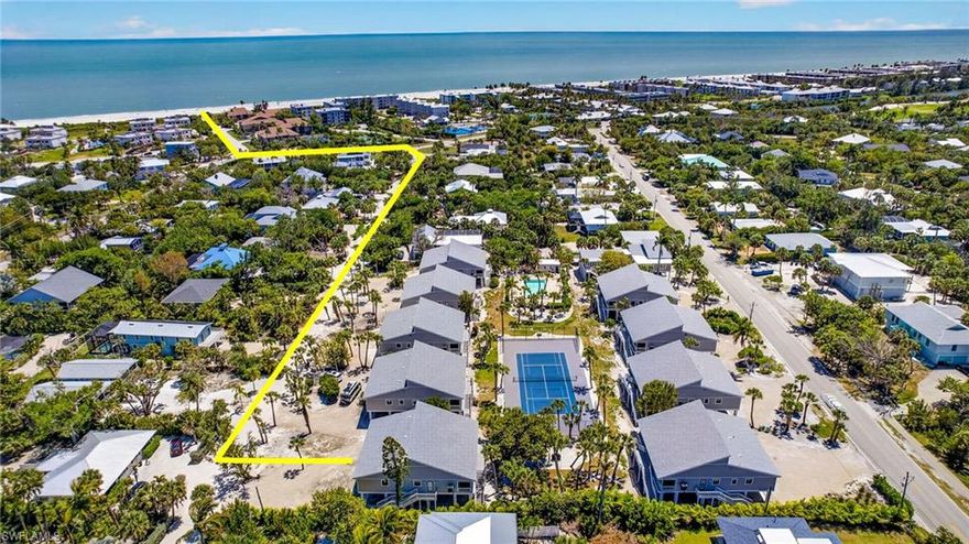 Every unit in this complex was raised above the FEMA Flood Elevation, creating parking and storage for each owner under building. New landscaping is planned for the summer of 2026.This Donax Village condo is located on peaceful Cardium Street and is a short 7-10 minute stroll to the beautiful Gulf beaches. This is the best of both worlds - condo living but feels like a residential home. This location is both quiet and close to the causeway. Unit has new electrical, plumbing, new efficiency Standard HVAC system, all windows and doors hurricane impact and low-energy rating, and new Trex decking and staircases. This beautiful 2 bedroom, 2 bath plus loft offers a large screen enclosed tiled lanai. Vaulted ceiling in living room, porcelain tile floors, kitchen with tray ceiling, new stainless steel Frigidaire appliances, shaker kitchen cabinets, quartz counters and vanities, recessed lighting and new fans throughout. New Mohawk carpet on stair treads and loft. Outlets for wall mounted TV's in all rooms and marble sills throughout. The laundry room has full size new Whirlpool washer & dryer and a laundry tub. Enjoy the outdoor shower after a day at the beach shelling. No expense was spared in the remodel of this Sanibel Island get-a-way. A wonderful beach community offering tennis/pickleball and sparkling community pool. Enjoy spectacular sunsets and some of the world's best shelling.
