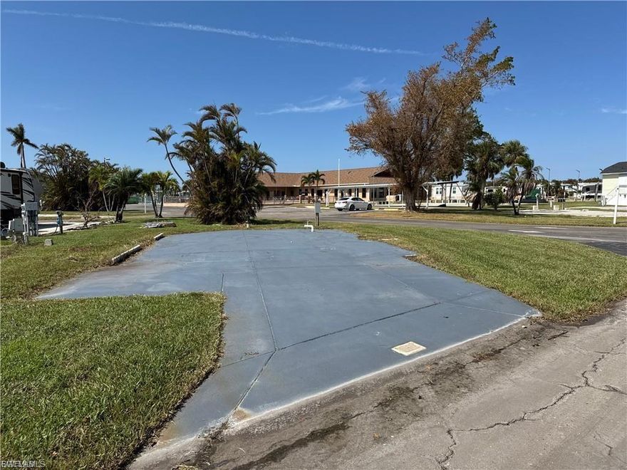 Welcome to Palmetto Palms where YOU own the land! This large clean corner lot is located on a beautiful boulevard just steps from the main hall and main pool. This lot has been cleaned, painted, has a 30amp/50amp/110 RV post installed and will accommodate a double wide manufactured home, ASHI park model tiny home, camper, RV, fifth wheel, destination trailer, rec-Van etc. With just a short stroll to tennis, horseshoes, volleyball, Pickleball, shuffleboard, a host of community activities, live music, happy hours, and even a second swimming pool, this active 55+ community will keep you entertained. This lot is located in the non-pet section and golf carts are allowed. The community is located just 3 miles from Times Square Fort Myers Beach, and just 1 mile from Bunche Beach on the Gulf of Mexico where you can pick shells, rent kayaks, and watch amazing sunsets over Sanibel Island. Walk to shopping, restaurants, the beach, and more. Welcome to endless summer!