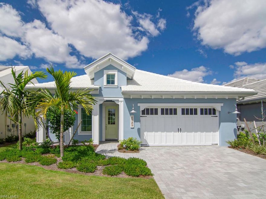 Designer perfection shows in this newly furnished Lakefront home. A beautiful coastal flair is reflected inside and out. Custom millwork welcomes guests in the entry Foyer, wide plank flooring runs throughout the house. The formal dining area has been enhanced with a shiplap wall and ceiling. Plantation shutters covering the impact glass windows, high end light fixtures and wood fans further compliment the space. Island kitchen with white cabinets, quartz counter tops, opens and merges well with the great room, perfect for entertaining. 10-12 foot double tray ceilings with crown molding offer additional volume and living space appeal in this home. A unique lot overlooking the lake but no houses on the other side, enjoy the large custom pool and spa privately. Landscaping and landscape lighting has also been added. 3 bedrooms each come with their own Full-Bath. The Master Suite offers 2 walk-in closets, a walk-in shower, dual sinks, tray ceilings and a bay window to bring in the light and pool views! The Isles offers a luxurious lifestyle with resort style amenities, community pools, Exercise facility, classes, sauna, tennis, pickleball, kayaks and paddle boards. Overlook Bar too!