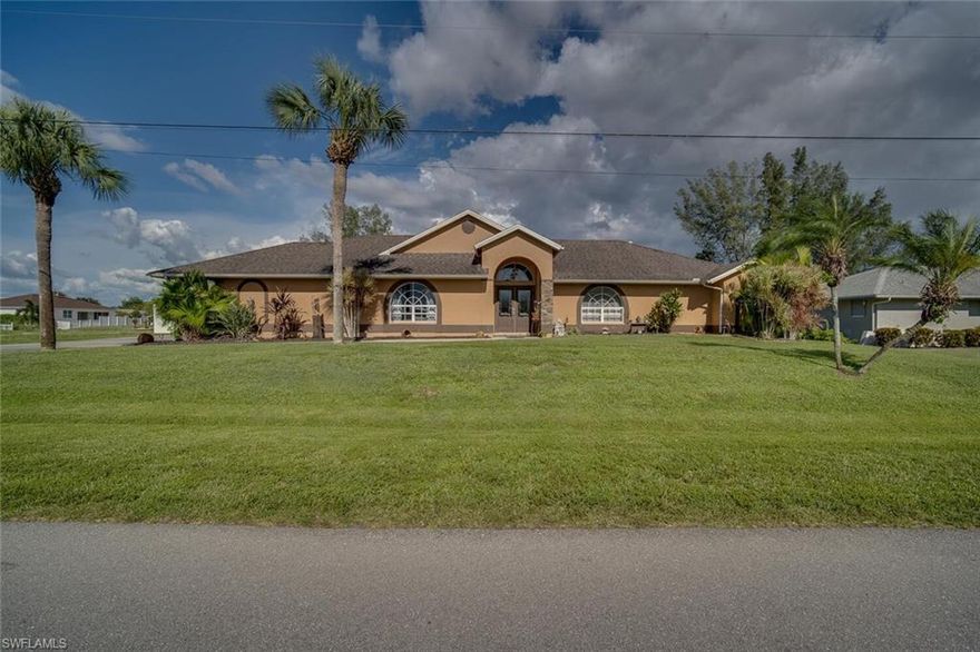 Beautiful 4 bedroom freshwater home sitting on a full 3 lot site. Enjoy kayaking or boating for miles with access to one of Cape Coral's largest freshwater lakes...Lake Kennedy. This home is tastefully upgraded with no detail left behind. Cathedral ceilings make this home feel open and airy, granite counter tops in kitchen & baths, stainless steal appliances, tile throughout, crown molding, fresh paint, and much more. Storage is not a problem. There is a full 2 car garage and an extra half garage to hold a golf cart, ride on mower, or just extra storage. The large screened lanai with private pool is great for entertaining. Fish right from your backyard and be sure to look out for the Sea otters and turtles. Located close to everything you will need. Must see!