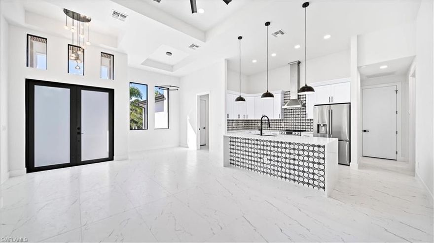 Brand new construction in beautiful Bokeelia! This stunning 3 bed, 3 bath home sits on half an acre and offers just under 1,600 sq ft of modern living. Featuring all tile flooring, quartz countertops, impact windows & doors, and a sleek open-concept layout with designer touches throughout. Enjoy outdoor living at its finest with a lanai and full summer kitchen complete with grill, sink, and beverage fridge. Surrounded by lush palms and nature, yet minutes from marinas, dining, and beaches, this home perfectly blends luxury and island tranquility. Don’t miss your chance to own a brand-new home in one of Pine Island’s most peaceful locations