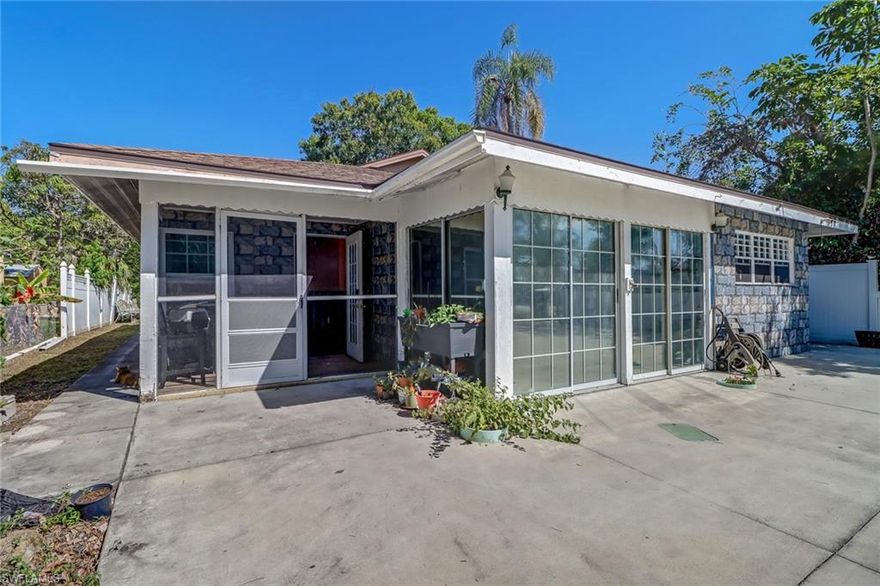 Investor Dream! Location, Location, Location! The lot itself is full of amazing fruit trees including some of the largest mango trees I have ever seen!  This Single Family 1 Story Block/Frame house was significantly damaged by Hurricane Ian and was flooded. The water was immediately removed along with drywall halfway up the walls, all cabinets, appliances, etc. The tile held up well. The AC is not working.  This home is located in an ideal little community, Naples Villas close to Naples Airport, 5th Avenue, Downtown Naples, Beaches, Dining, Shopping and more! No HOA, Large Lot, Room for a Pool. Make this home your own or BUILD NEW! Cash Only As-Is Contracts.