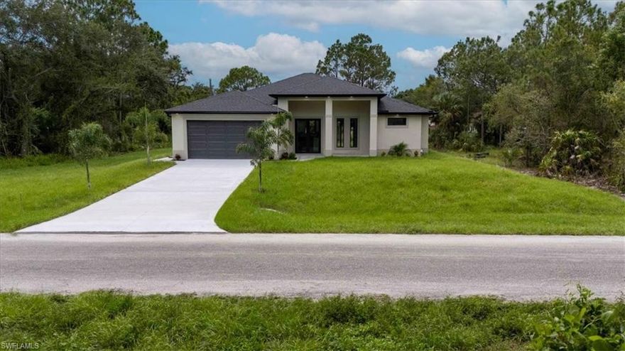 This beautiful property sits on a 0.50-acre lot, located in one of the best areas of Lehigh Acres. This property has four bedrooms and two bathrooms. All doors and windows are impact-resistant, and it has a full outdoor kitchen.