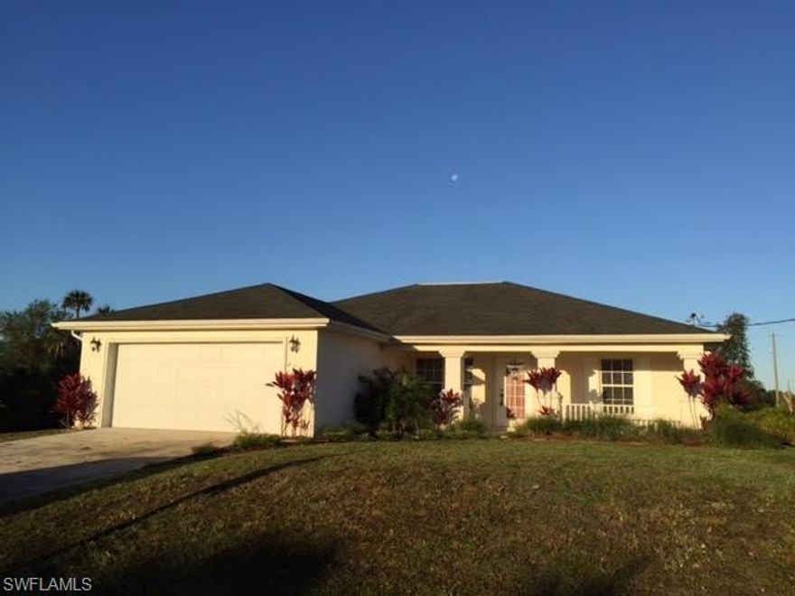 Beautifully maintained home on a dead end street....very quiet and private!  Diagonally installed tile flooring, carpeting throughout the bedrooms, high ceilings, sprinkler and security systems and nicely laid out island kitchen!  You'll love the inviting farmer's porch accented by lush landscaping and accenting water feature!.  Come take a look at this beauty BEFORE it's GONE!