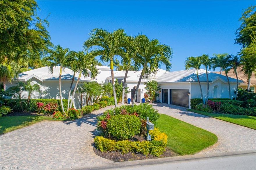 This is the ultimate private estate, with a resort feel & spacious layout, perfect for casual living & entertaining lots of friends/family. Beautifully landscaped, the home has-2 screened lanais, 2 balconies, south-facing pool/spa/sun deck, and a fire-pit seating area with stone deck overlooking lake/golf. Including the private cabana, the home has 4 BDs, 4.5 baths, volume ceilings, a wall of built-in cabinetry in the family room, sweeping sliders with transom windows above, a bar area that seats 8-10, with 2 wine coolers, and an elevator (and stairway) to a guest suite & office. The kitchen has granite countertops & overlooks the family room with lanai & pool/spa beyond. The guest cabana includes a kitchenette, sitting room, large bedroom, full bath & washer/dryer. The garage for two cars + golf cart is air conditioned & filled with storage cabinets. Roof, HVAC & pool equipment are 3 years old. Audubon has a new lifestyle center with state-of-the-art fitness center & indoor/outdoor dining. There's also a new boardwalk to the bay with kayak launch, club house, golf, tennis, bocce, pickle ball, 25 meter heated swimming pool & is minutes to beaches and dining in N. Naples.