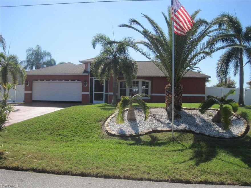 Nestled on Honeymoon Lake in NW Cape Coral. About 600ft of water view plus looking across the lake down a canal. This 3 bed 2 bath, recently remodeled (except kitchen) home offers many features and upgrades like camera surveillance system, fenced in backyard, solar power panels and accordion shutters (both installed 2018), manual boat lift (for jet ski), extended tiled lanai, standby generator & 500 gal tank (2019). The roof & water heater were replaced 2020, new AC in 2019. Delightful landscaping with lighting. Beautiful views of the lake from all three bedrooms and the glass sliding doors offer direct access to the lanai. The guest bathroom is a pool bath. Enjoy the gorgeous views over the lake from the wooden boat dock with Tiki Hut or take your jet ski out for a ride on the lake. Spectacular nature scenery is waiting for you. Relax and enjoy this tranquil paradise. Vacation all year around!