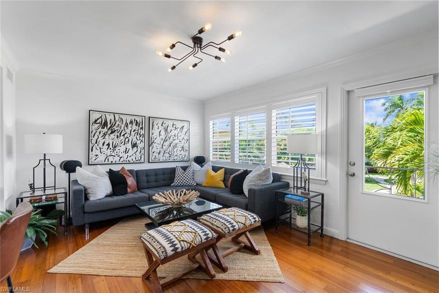 Experience the best of Olde Naples living at 221 8th Ave S #221B, where timeless coastal charm and modern updates come together in a beautifully maintained courtyard setting. This inviting west facing corner condo is perfectly positioned just a short stroll from world-class shopping and dining on 5th Ave S & 3rd St S, and the stunning white-sand beaches along the Gulf. Inside, the home features an absolutely fabulous renovation and abundance of natural light! Upgrades throughout including a stunning kitchen with nice appliances and marble countertops, beautiful wood flooring, fresh and contemporary bathroom renovation, Phillips Hue lighting system, newer Daikin HVAC & water heater, custom plantation shutters,   - ideal for both everyday living and entertaining guests. Impact-resistant doors and windows add an extra layer of comfort with enhanced security, energy efficiency, and storm protection. Surrounded by lush landscaping, the peaceful courtyard offers a quiet retreat while still placing you in the heart of it all, as well as 2 balcony options for private outdoor seating! Whether you’re searching for a seasonal escape, an investment opportunity, or a full-time residence, this charming condo captures the essence of the Naples lifestyle in one of its most desirable neighborhoods!