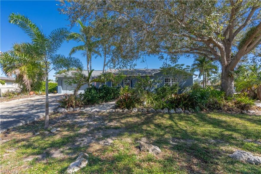 This home has VALUE! The roof is new as of 2023, the A/C is new as of 2020, the washer & dryer is new as of 2022, and the refrigerator is new as of 2020.  It sits on a HUGE corner lot with incredibly well-maintained landscaping and is on city water and sewer as well as NOT in a flood zone - HUUUUUGE savings.  The home has tile throughout, granite countertops in the kitchen, an oversized laundry/utility room with plenty of room for storage or built-in shelving, matching blinds throughout, and a brick accent wall in the living area.  The back yard features an oversized lanai (1200sqft) with upgraded landscaping.  San Carlos Park is the single most well-placed neighborhoods in all of Lee County featuring quick access to US-41, I-75, and all major areas of town.