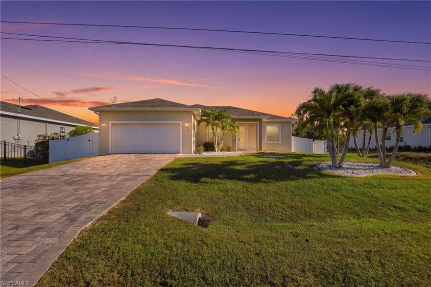 Welcome home! This beautiful 3-bedroom, 2-bath residence, built in 2020, is located in a desirable Cape Coral area and offers nearly 2,000 sq ft of living space. From the moment you arrive, you’ll notice the great curb appeal with a nicely sized paver driveway and beautiful palm trees. Inside, the home features a functional split floor plan with a formal dining area and two separate living spaces, offering flexibility for everyday living and entertaining. Interior features include tile flooring throughout, high ceilings, tall interior doors, impact-rated windows and doors, and zebra blinds throughout the home for added privacy. The open-concept kitchen offers a large island, granite countertops, ample cabinet space, and all appliances, including the washer and dryer. The home is finished in modern yet warm tones, creating a comfortable and inviting feel throughout. The primary suite includes double walk-in closets, dual vanities, a soaking/jacuzzi tub, and a walk-in shower. Additional highlights include an under-truss lanai, irrigation system, mature landscaping, and a backyard with plenty of room to build your dream pool. Best part—no flood insurance required! A LOMA letter is in place, offering added savings and peace of mind. This home is competitively priced and ready for its next owner—schedule your showing and bring your offer! Conveniently located just minutes from Publix and The Shops at Coral Shores, offering restaurants and bars. Matlacha is also a short drive away, Tropicana Park is right across the street, and the property is near ongoing and future developments, including Crystal Lake Park and the Seven Islands Project. Ideal for a primary residence, seasonal home, or investment opportunity. This location is booming! Come see it today! Easy to show. This is your next home.