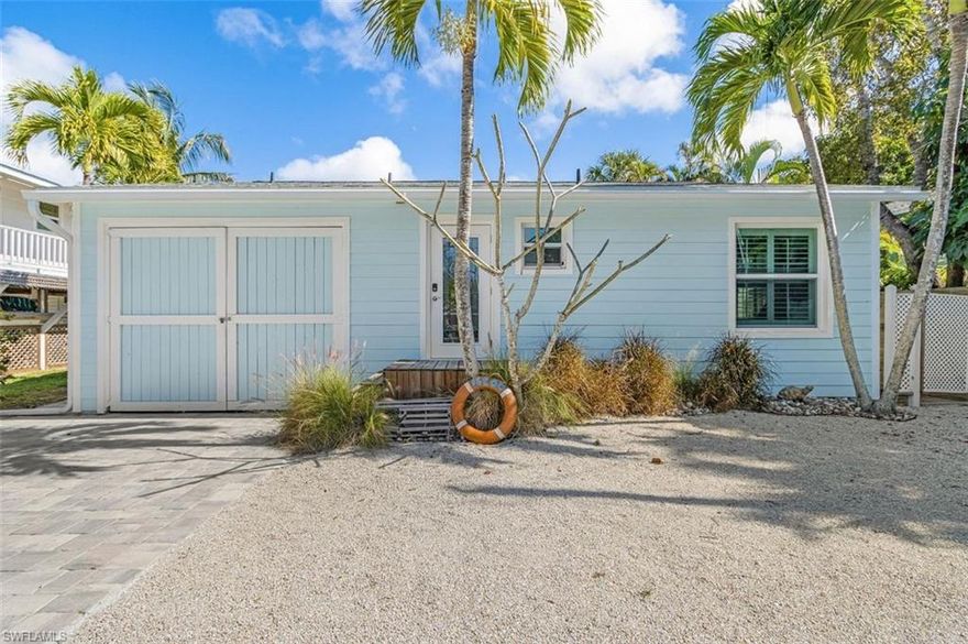 This is a rare opportunity for a beautiful island home with very Quick Direct Gulf Access. The property is located in the fisherman's/boater's paradise of Bokeelia/Pine Island. This quaint island style cottage is being sold fully furnished and features 2 bed/2 bath, large/open living room and dining room, a large screened-in lanai, plus a small garage which is perfect to store all your fishing supplies and a golf cart, or motorcycles. Overlooking the canal is a boatlift, firepit and BBQ shed. Recent upgrades include a new roof, new AC, impact windows, pavers, amazing kitchen with high-end cabinets, stainless appliances, quartz counter-tops, updated bathroom, plantations shutters, and tile plank flooring. Now, the best part, once on your boat, you are less than 5 minutes to the open water of Charlotte Harbor. You can be in Boca Grande Pass fishing for Tarpon or having lunch on famous Cabbage Key within 15 minutes. This is a true boaters paradise, and won't last long. Make a showing appointment today