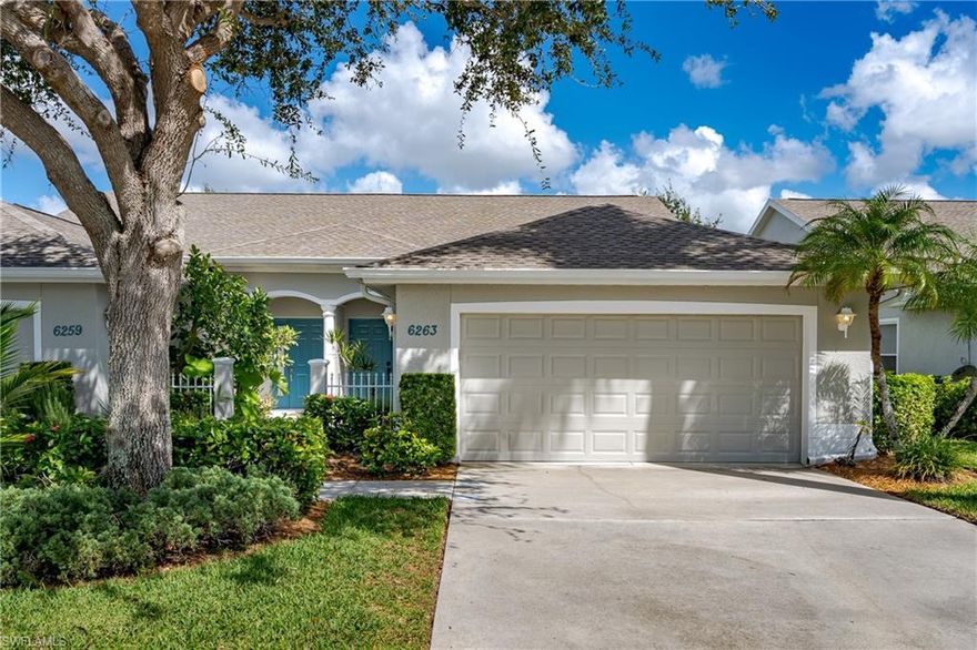 PRICE IMPROVEMENT! If you are looking for a beautiful villa home that is move-in ready and in a great location, then this is the home for you.  This charming and quaint villa has been freshly painted throughout the interior and exterior, new appliances, new luxury vinyl flooring just installed throughout, newer garage door with new beautiful epoxy skid free flooring in this 2 car garage,  private oversized lanai with lake view that has a newer cage and screens and completely renovated lanai!! Primary bedroom overlooks the lake and has a large walk in closet, dual sinks in the master bathroom and the master shower has grab bars with newer slip free tile flooring.  Ceiling fans throughout the home and blinds on all windows. Newer A/C and the roof was replaced in 2021 with upgraded plywood to meet current building codes. This lovely 3 bedroom 2 full bath home is perfect for full-time or seasonal residence. Low HOA fees and without the hassle of exterior maintenance.  The property is within a one minute walk to the community pool!! Home is close to restaurants, shopping, downtown Naples, medical and beaches.  Don't miss out on this rarely available homes in this quiet community of Mandalay.