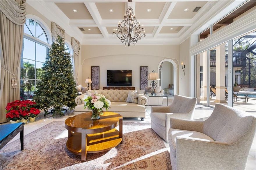 A quiet sense of arrival unfolds as you approach this remarkable custom estate built by Harwick Homes, which is gracefully positioned within Teramo. Framed by a sweeping preserve backdrop and introduced by striking iron front doors, the home immediately conveys a feeling of privacy, permanence and understated luxury. Inside, the home is filled with natural light, drawn in through expansive impact-rated windows and doors that connect the interior to its tranquil surroundings. Volume ceilings, marble flooring and wood-stained tongue-and-groove architectural details create a timeless and refined aesthetic, while a thoughtfully designed floor plan offers a seamless balance of openness and intimacy. Every bedroom is en suite, providing comfort and privacy for residents and guests. The primary bedroom is an escape with gas fireplace in the bath, with an auto-sensing pathway illumination that enhances ambiance and ease of living between the bedroom and bath, as well as expansive closets. The dedicated den offers flexibility for work, reading or creative pursuits and provides privacy with its location near the primary suite. The heart of the home is a beautifully appointed gourmet kitchen, designed to gather, entertain and inspire. High-end appliances, dual islands, a walk-in pantry with a sink and additional dishwasher, a separate wet bar with a walk-in wine storage and two undercounter wine coolers create an effortless setting for hosting. Integrated surround sound, a Control4 system and a Lutron lighting system offer convenience throughout the home. Indoor living transitions naturally outdoors to an expansive screened lanai that feels like a private resort. A custom saltwater pool and spa, outdoor kitchen, fireplace and firepit invite sun-drenched afternoons and elegant evenings under the stars, all overlooking peaceful preserve views that provide an enduring sense of serenity and escape. Two separate two-car garages, each climate-controlled, offer exceptional flexibility for vehicles, storage or hobbies. Additional dedicated storage areas inside the home and within the garage ensure everything has its place, while a whole-home generator provides peace of mind. Enjoy toes in the sand and golden sunsets at Mediterra's fully renovated private Beach Club. Imagine arriving to have your car valet-parked and lounge chairs and umbrellas waiting for your arrival or set up upon your request. The restaurant features indoor and alfresco dining, a full bar and a swimming pool. In award-winning community of Mediterra, you can have it all with 36 holes of Tom Fazio championship golf, Har-Tru tennis courts, pickleball, bocce and a new Lifestyle Center coming soon! With its natural beauty, refined atmosphere and exceptional lifestyle, this home offers more than a place to live. It is a thoughtfully crafted retreat where elegance, comfort and modern convenience are all just moments from Naples world-class beaches, dining and shopping.