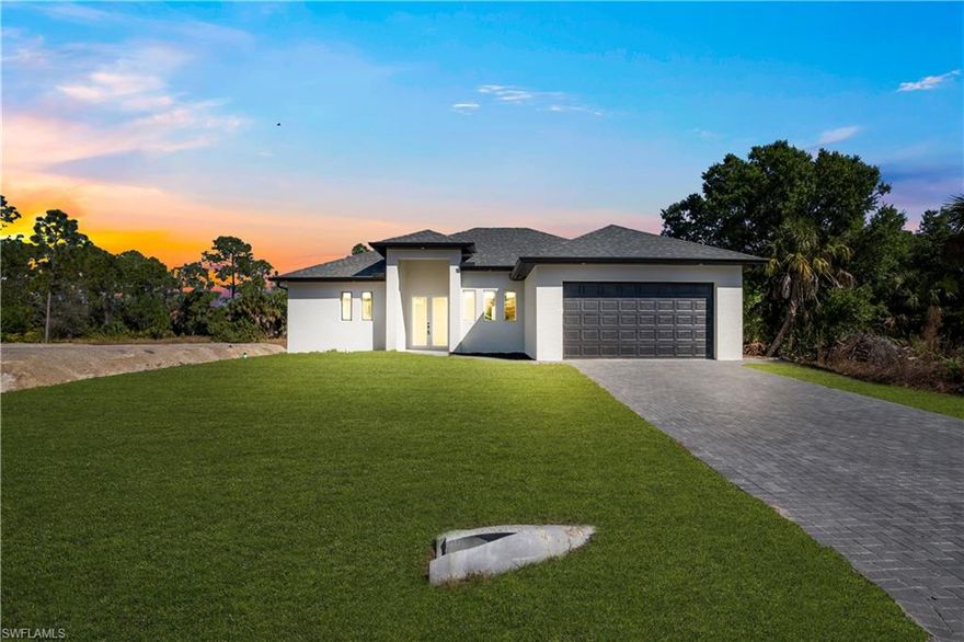 Brand new construction located in a prime area of Lehigh Acres! Seller willing to assist with buyer’s closing costs! This beautifully designed home features 3 spacious bedrooms with walk-in closets, a dedicated office/den, and a bright open-concept layout filled with natural light.

The modern kitchen showcases acrylic-finish cabinetry in the kitchen and laundry room, a large center island, and plenty of space for cooking and entertaining. The home is equipped with impact-resistant doors and windows, providing added security and energy efficiency.

Additional features include a 2-car garage with an impact-resistant glass side door and a paver driveway that enhances curb appeal.

Step outside to enjoy the covered lanai with an outdoor kitchen and convenient half bathroom, creating the perfect space to entertain and design the backyard of your dreams.

The property also backs up to a canal with rear access, offering additional privacy and flexibility.

Ideally located just 5 minutes from Walmart, Aldi, restaurants, and major shopping areas, this home combines modern design, functionality, and an excellent location.