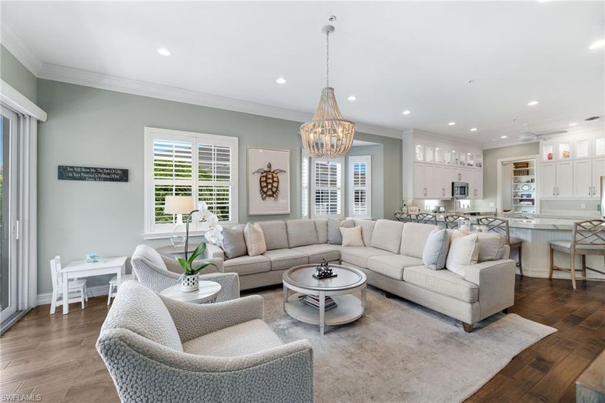 Step into a level of luxury rarely offered in Breakwater at Pelican Bay, truly a one-of-a-kind opportunity to own one of the most exceptional and unique residence in the entire community. This fully remodeled and completely reimagined floor plan features 3 bedrooms, a private den, and 2.5 baths, along with an extraordinarily rare 3-car garage. Designed as a showcase of meticulous craftsmanship and premium finishes, the home exudes sophisticated modern coastal elegance and unparalleled comfort throughout

The chef’s kitchen features stunning book matched natural quartzite countertops, custom floor-to-ceiling cabinetry, dual wine coolers, and an induction range, all seamlessly integrated into the open living space. No expense was spared while over improving this unit, upgrades include hand-scraped walnut hardwood flooring, two-piece crown molding, three-panel solid-core doors, a total smart home living with a Lutron lighting system and automated window shades, Hue lighting, and custom plantation shutters, and impact-resistant windows and doors throughout.

The private den includes custom built-in bookshelves, filing cabniets and a desk, creating the ideal home office or flex space. The luxurious primary suite offers custom closets with built-in dressers and a spa-inspired bath finished in floor-to-ceiling Carrara marble with heated floors and a Toto Washlet toilet.

Additional features include a custom-designed laundry room with a large capacity LG stackable washer/dryer, extensive cabinetry and built-in drying racks, along with a tankless hot water heater for endless hot water. The other bedrooms are complete with custom closets with built-in dressers.

The elevator leads to one of the rarest offerings in Breakwater a true 3-car fully air-conditioned and insulated garage, one of only a select few a rarely available in the community, featuring Concrete Science flooring, NewAge Commercial Pro Series 18-gauge steel cabinetry and tools, along with an additional full size refrigerator/freezer and 50-amp electric service for high speed vehicle charging.

Enjoy peaceful outdoor living from the southwest-facing lanai with marble flooring, custom cedar ceiling, and lush landscaped for the in ultimate privacy.

Perfectly situated directly across from Breakwater’s newly renovated clubhouse and pool, this residence truly checks all the boxes and offers unmatched convenience while maintaining privacy behind mature hedging. Breakwater is a gated community known for ZERO hurricane flooding and extensive exterior redesigned renovations including new windows, roofs, and fresh coastal paint colors.

Residents of Pelican Bay enjoy world-class amenities including private beach access, two beachfront restaurants, tennis, pickleball, fitness/life center, wellness classes, and miles of scenic walking and biking paths. Ideally located near Mercato, Pavilion, and Pelican Bay Community Center.

Don’t miss this once in a generation opportunity.