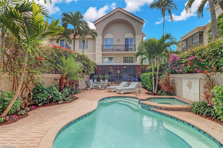 Discover a tropical paradise in Olde Naples when you tour this turnkey furnished, end-unit residence in Isla Mar. From the moment you step foot into this 2,280 square foot, multi-story home, you’ll notice shiplap ceilings and tasteful coastal accessories strategically placed throughout the space to immerse you in Florida living. A living area and luxury kitchen are separated by a large kitchen island/breakfast bar with plenty of seating for family and friends, while a separate living room and dining room offer additional entertainment space with all the comforts of home. The master bedroom features a large master bathroom with a separate tub and shower, as well as dual sinks. Additional features include a laundry room, private elevator, two-car garage, multiple balconies, impact resistant windows and doors, a screened in patio, and a tropical outdoor living and dining space with a gas-heated pool and spa, a privacy wall, and a water display. With a gorgeous design and a prime location just four short blocks to the beach and 3rd Street shops, this exquisite Naples home will not last long.