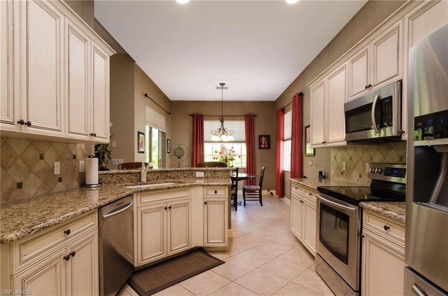 Located in Delasol, one of North Naples most sought after communities, this beautifully decorated 3 bedroom home is move-in ready. Enjoy the quietness of living on a cul-de-sac and being able to take a short walk to the clubhouse. The home has a spacious great room, 3 bedrooms, 2 bathrooms and large master bedroom. The luscious landscaping to the back of the home allows for great privacy and a peaceful setting on the screened lanai. The home has many upgrades including: custom cabinetry, granite counter tops, custom wall finish in master bath and kitchen, new epoxy garage floor, plantation shutters, wood flooring and crown molding. Don't miss the chance to see the best priced home in Delasol!