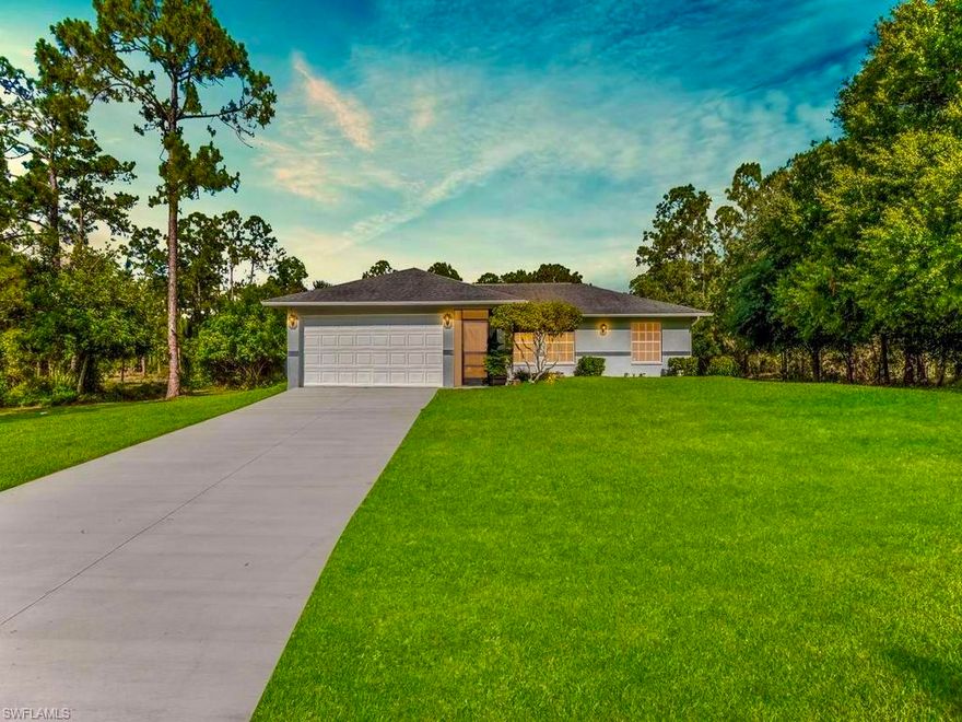 Welcome to this meticulously maintained 3/2 l fenced HALF ACRE home nestled away on a quiet street. This smart home has been professionally landscaped & freshly painted spotlighting  new luxury vinyl flooring, GRAND room with cathedral ceilings & welcoming breakfast bar, new STAINLESS STEEL applainces, and a newer softener system. It also highlights a (2016) dimensional shingle roof, (2017) hvac system, premium fixtures, a desirable screened front porch, window treatments, HIGH SPEED internet, and pavers on back patio great for entertaining. This peaceful property with minimal traffic is NOT in a flood zone, & offers the perfect blend of comfort, privacy, and convenience while still being just minutes from all major amenities and a quick commute to Fort Myers. Schedule your private showing today!