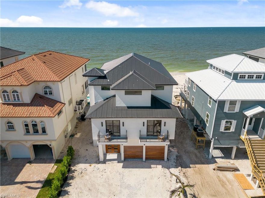 H8928   FULLY RENOVATED DIRECT BEACHFRONT MASTERPIECE! This state-of-the-art home was professionally designed and offers some of the finest features and finishes along with a new roof in 2021. Enjoy the sugar sand & turquoise Gulf of Mexico waters as your backyard with unbeatable views. This 5 bed, 4.5 bath home offers whole house wood & tile floors, volume ceilings, & a pool/spa. Dramatic open floor plan with pocketing sliders to the beautiful outdoor balcony with spectacular ocean views. Offers an incredible master suite has a private balcony, large walk-in closet, dual sinks, & a spacious shower. Chef’s kitchen includes Thermador appliances, a wet bar, built-in custom cabinetry, quartz counters & a large walk-in pantry. Features include a surround sound system, impact glass windows/doors & private elevator. Located minutes to Mercato & North Naples’ amenities, easy access to I75 & the International Airport. This Gulf-front residence encompasses the best of the best; all overlooking the stunning Gulf of Mexico with the sugar sand beach as your backyard.