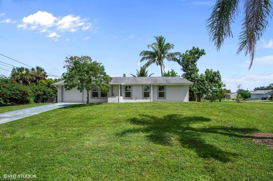 Huge Corner Lot & FULLY RENOVATED!! This beautiful Golden Gate City home offers 3 Bedrooms, 2 Bathrooms, One Car Garage plus Large rear open Lanai. Everything is NEW. Gorgeous Porcelain Tile throughout Floors, Lanai, Baths & Kitchen Backsplash, White wood cabinets in Kitchen & Baths including White Quarts Tops, New Stainless Steel Appliances, New Low-E Windows, new A/C, Fresh Stucco all around with new exterior/interior paint, New garage door, all new plumbing, New exterior & interior doors & sliders. All New light fixtures, receptacles  & switches. The Open Great Room provides easy access to the rear patio overlooking a very nice oversize yard full of fruit trees and with enough room for a pool. Send your offer in TODAY, as this home won’t last.