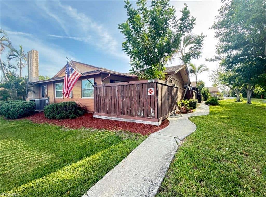 Photo of 6320 Royal Woods DR, FORT MYERS, FL 33908 (MLS # 226027291)