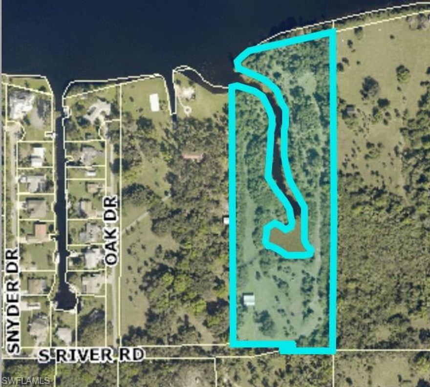 This is a truly unique and one of a kind offering.  Amazing 10 Acres ON the river featuring an 18 foot deep canal winding through the middle of the property and a large basin at the end.  Caloosahatchee Regional State Park is located across the river from this stunning property so you will always have a beautiful natural, unobstructed view.  The building department states that the property can be subdivided into 8-10 one acre parcels with the opportunity for a developing eight-ten homes on truly incomparable properties.  Or keep it all for yourself and build your dream home with privacy, space and an unbelievable view.  The possibilities with this gem are simply endless and incredible.   Attached are parcels splits to give you an idea of the lot layouts and configurations with roads included.  Until you see it you will not able to truly appreciate the beauty, please be sure to click on the virtual tour and prepare to fall in love.