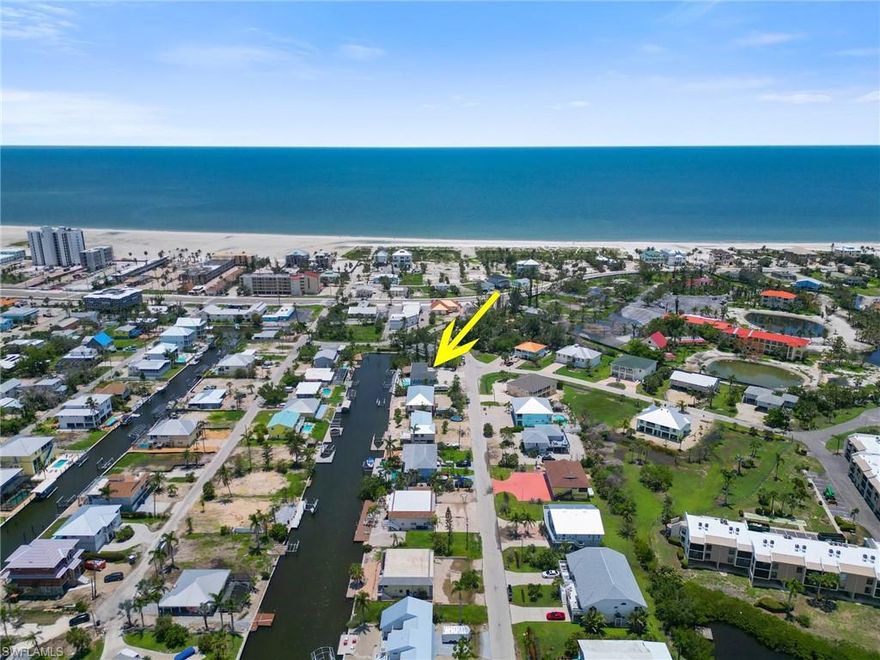 Whether you're a first time investor or looking to add to your investment portfolio; this income generating triplex on Fort Myers Beach is the BEST OF THE BEST. Located in a weekly rental zone and on an oversized canal lot, this property offers direct gulf access by boat and a 3 minute walk to public beach access. Making it a dream vacation destination. The property consists of a 4/4, a 3/3, and a 1/1 unit. All are offered turnkey, beautifully furnished & decorated including washer/dryer in each individual unit. The outside gathering space is an oasis. Designed to maximum your vacation. There is a new higher seawall spanning over 100 feet with new dock and 2 lifts. Launch your paddle boards & kayaks from your backyard. Swim in the new salt water pool. Tan on the sun shelf & stone paver deck. Relax under the huge tiki. Fish, grill and utilize the abundant outdoor space for games, family fun & making memories. Also has RV parking equipped with a 30 & 50 amp hook-up. Perfectly created for new or experienced investors to easily take over and develop its unlimited potential. You absolutely can NOT go wrong with this investment!