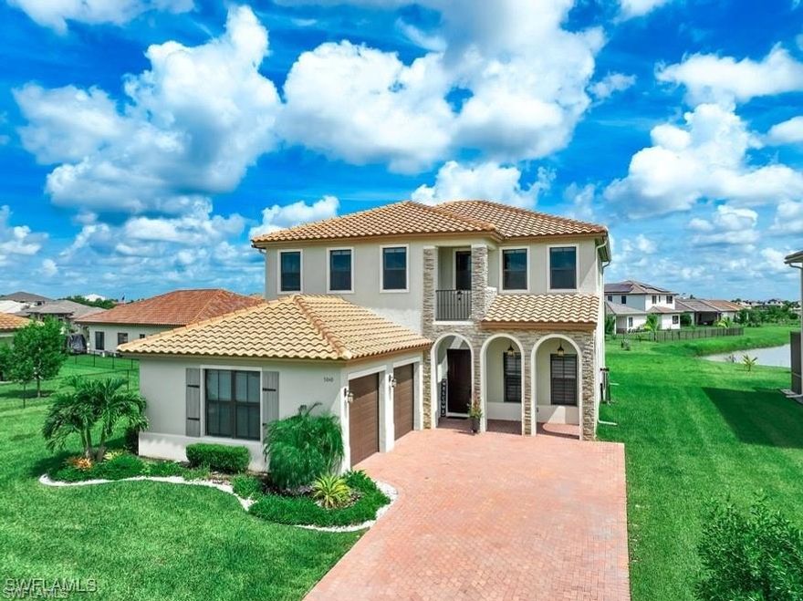 Experience lakefront living at its finest in this beautifully home located in one of the most desirable communities in the area. This spacious residence offers an exceptional layout with 4 bedrooms plus a fully built-out 5th bedroom, giving you the flexibility to use it as a guest suite, media room, gym, or creative space. With 3 full bathrooms, the home is designed to accommodate families, guests, and those who value comfort and privacy.

Upon entering, you are greeted by bright, open living areas that frame the stunning lake views, creating an immediate sense of tranquility and connection with nature. The home features a modern glass-enclosed studio, ideal for reading, relaxing, or entertaining, as well as a private auxiliary office, perfectly suited for remote work or study. The layout is both functional and elegant, offering seamless flow between the social areas and the more intimate corners of the home.
The property includes 2 covered parking spaces and 4 additional exterior parking spots, providing convenience for homeowners and guests alike. Large windows throughout the home allow natural light to fill every space, enhancing its warmth and inviting atmosphere.
Residents enjoy access to an exceptional Clubhouse equipped with lifestyle amenities such as a billiards/pool table, coworking area, dog park, children’s playgrounds, a refreshing swimming pool, BBQ area, and a spacious social room perfect for gatherings and events. The community was designed with outdoor living in mind, offering expansive tennis and basketball courts, running trails, and golf cart paths that promote an active and healthy lifestyle.

One of the most attractive features of the neighborhood is the convenience of having a Publix supermarket located inside the community, just five minutes from the home. This rare benefit adds tremendous value by offering residents easy access to daily essentials without leaving the area.

This home combines space, comfort, modern design, and a strong sense of community, all enhanced by beautiful natural surroundings and resort-style amenities. Whether you’re looking for a serene family residence or a property that supports a dynamic work-from-home lifestyle, this lakefront gem delivers an exceptional living experience.