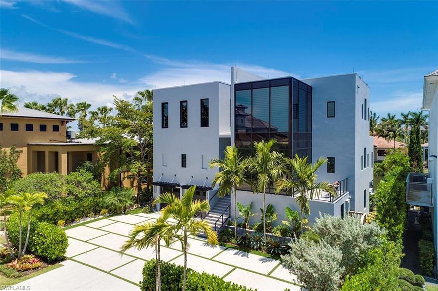 One of the most magnificent homes ever constructed in Vanderbilt Beach. Built in 2016 to exacting standards by well known builder Zynda Custom Homes and innovatively designed by Herscoe Hajjar Architects. This home is approximately 4664 sq ft under air and over 9100 sq ft total. Inside, the stunning renowned ALNO quality kitchen with fabulous cabinetry, high end appliances by MIELE, coffee maker, and steam oven is a chef and entertainer's dream. The spectacular great room boasts high ceilings with an unbelievable balcony with stairs leading to the pool area capitalizing on views of the water. The home features exquisite interior finishes, four full bedrooms, two of which are master suites, two den/media rooms, an elevator and an extensive pool complex with spa, outdoor area with lounge and lower level with access to the resort style living. This estate has a large boat dock with 24,000 lb boat lift, a full oversized 3.5-car garage and your private beach access that leads you to a world-class beach and the Gulf of Mexico. With unmatched craftsmanship throughout and award winning design, this immaculately maintained home has become, in a short period of time, a Vanderbilt Beach icon.