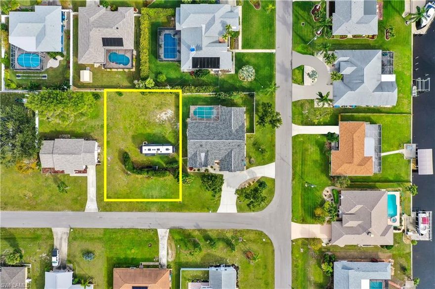 VACANT LAND! Almost completely cleared with exception to privacy hedge that was put in place. Use the land to build the home of your dreams or simply add the vacant parcel to your investment portfolio. This area of Cape Coral is highly desired due to its' easy access to the Midpoint Bridge, surrounded by tons of dining/shopping options, and close to waterfront parks, community boat ramps, and public golf courses.