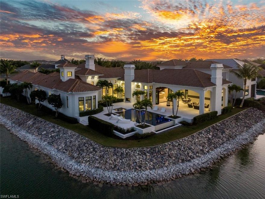 Perfectly situated on a highly desirable private corner peninsula lot, this distinctive estate home
combines inspiration from Miromar’s rich lifestyle with an elegant modern point of view. Sweeping
waterfront views and an open concept design furnished with sophisticated architectural elements create
a dreamy setting ideal for entertaining. The outdoor oasis features an infinity pool, fireplace, picturesque wrap around views and a private boat dock. The stylish open chef’s kitchen is a foodie’s delight with ample storage that has been gracefully enclosed in custom 2-tone cabinetry. A dramatic winding staircase leads from the great room to a full guest suite with a balcony and a 2nd home office.
Modern lighting further highlights the beauty of this incredible lakeside retreat fully equipped with
every lifestyle convenience including 4 car ports, electric hurricane shutters, screens under the lanai and
a generator. Owners enjoy an expansive amenity suite including 700-acres of freshwater lakes, 3 miles of white sand beaches, spa &amp; fitness center, concierge service, Clubhouse, Blue Water Beach Grill, and optional
membership to Arthur Hills Signature Championship golf course.