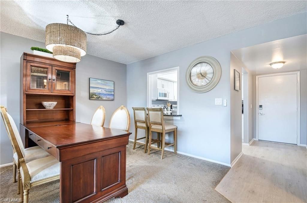 Photo of 5651 Rattlesnake Hamm RD #C-201, NAPLES, FL 34113 (MLS # 226015042)