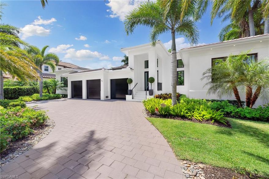 Desired "West of Crayton" location, this newly built 4+Bed/5 Bath Moorings home has it all. Less than a mile to your private beach and on a quiet street enter to find an open floor plan with an abundance of natural light,  voluminous detailed ceilings & decorative beams. Fully pocketing impact sliders allow for seamless integration of the indoor/outdoor space. Ideal southern exposure provides sun all day on your outdoor oasis complete with pool + spa, built in grill and lounge w/ fireplace and T.V. The expansive great room floor plan features wide plank oak flooring & opens to dining room with custom bar and kitchen complete with island seating, ample counter space, and Thermador appliances. Primary suite features dual walk-in closets, a spa like bathroom with a shower & soaking tub, dual sinks, makeup vanity and skylights for even more natural light. Three additional guest rooms (all ensuite) w/ a den/office that can easily handle overflow guests. This fully-fenced property is landscaped with privacy in mind & complete with circular, paver driveway and 3-car garage. Added bonus of  "turnkey" furnished + significant rental income for those not ready for full time life in Naples!