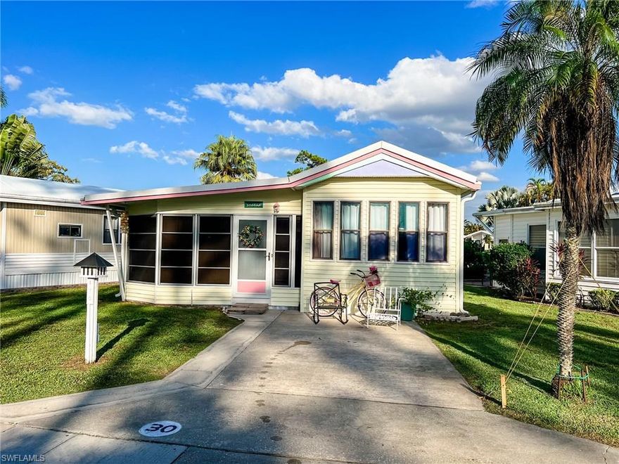 Welcome to your piece of paradise! Step inside the bright and inviting large Florida room. With updated flooring and furniture throughout. Custom pull out couch for your guests. Laundry in hallway and large storage room in back of house. A few steps up to the main level with a stylish sitting area and eat in kitchen with tons of storage! Bathroom with door to bedroom for easy access. New queen size mattress and spacious closet. This home has rubber roof 2015, new AC 2017, new ductwork and additional vents added, with UV light filtration in 2021. Plus all new plumbing and additional tiedowns under the home. All the major items have been updated and ready for you to enjoy. Small covered back patio with room to expand. Turnkey sold completely furnished. Corkscrew Woodlands is a 55+ Gated community. Enjoy the lakefront lap pool, hot tub, and fishing pier. Paddle-boat or kayak on the 23-acre lake. Wildlife on the miles of nature trails, bridges and canals, including a butterfly garden. Sporting and Social events, something for everyone! Affordable HOA fees of $669/quarter includes Water, Sewer, Basic Cable and Lawn maintenance! Land is OWNED, no lot rent!