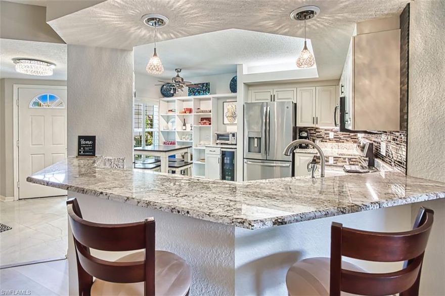 Exceptional Opportunity in the Heart of Estero.  Step into this beautifully updated and redesigned 2-bedroom, 2-bath home in the sought-after community of Lighthouse Bay—just steps to the amenity center and complete with a one-car garage.
From the moment you enter, you'll be impressed by the large-format porcelain tile and luxury wood-style vinyl flooring throughout. The open-concept layout features a beautiful kitchen with custom built-ins, added cabinetry, roll-out trays, and expanded workspace—all topped with premium-level granite.
The lakeside lanai has been transformed into a sunroom with impact-resistant doors, offering serene views of the lake and fountain. All windows have been upgraded to impact glass for peace of mind and energy efficiency.
The spacious owner’s suite includes thoughtfully designed custom closets that maximize storage. The en-suite bathroom boasts dual sinks, upgraded cabinetry, and ample space for all your essentials. Premium lighting and fixtures throughout the home elevate the style, while the turnkey furnishings make moving in effortless.  Lighthouse Bay offers a gated, resort-style lifestyle with five pools (including a lap pool), 2.5 miles of scenic walking and jogging paths, tennis courts with a pro, bocce, pickleball, two boat houses, fitness center, sauna, clubhouse, library, and an arts and learning center.  Ideally located in the Village of Estero, this home is less than a mile from top-tier shopping and dining. It includes a Bronze Membership to The Brooks Commons Club, offering access to a private restaurant, enrichment programs, social events, pickleball, and more. You're just minutes from Coconut Point Mall, fine dining, entertainment, Southwest Florida International Airport, and the area’s beautiful Gulf beaches—making this condo the perfect place to enjoy everything Southwest Florida has to offer.