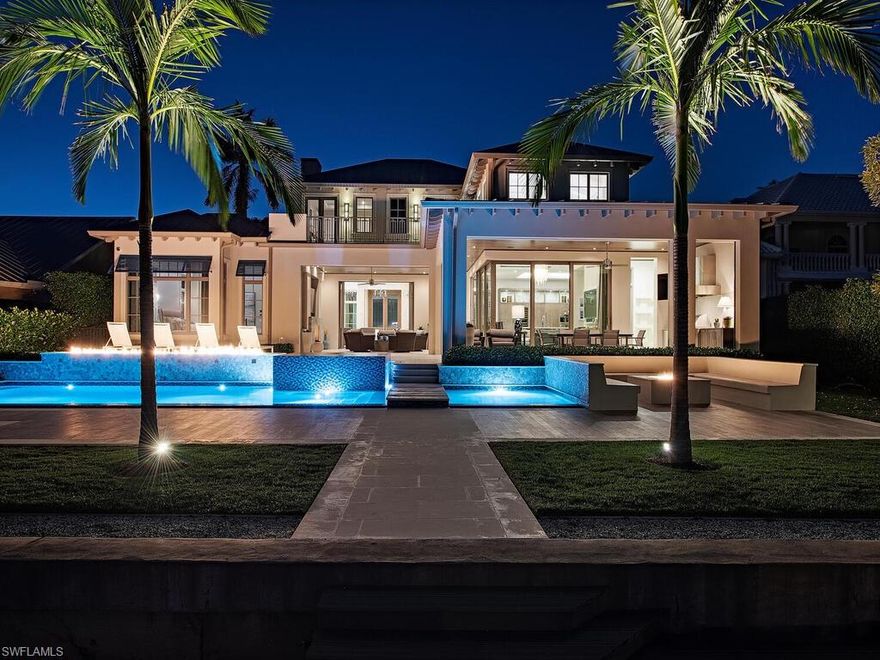 Unparalleled quality meets unrivaled views! Sweeping vistas across Naples Bay invite you as you enter this magnificent home. Attention to detail and the finest materials were used to complete this custom home completed in 2018. Highlights in this coastal contemporary style residence include full concrete construction, Gourmet kitchen with Subzero/Wolf appliances, climate controlled wine room, security and lighting systems with cameras, acoustic stretch fabric ceilings, automatic shades on all windows, and an amazing outdoor space with full outdoor kitchen. Walking out the pocketing 10' Windoor sliding glass doors you will find the ultimate resort like feel complete with a large outdoor kitchen, outdoor shower, multiple fire features including built in seating surrounding a fire pit overlooking the bay. All of this located just steps from white sandy beaches and famous 3rd St. restaurants and shops. This is Naples living at its finest!